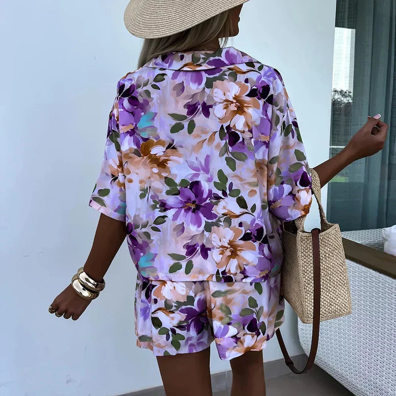 Yasmine - bloemen playsuit met riem