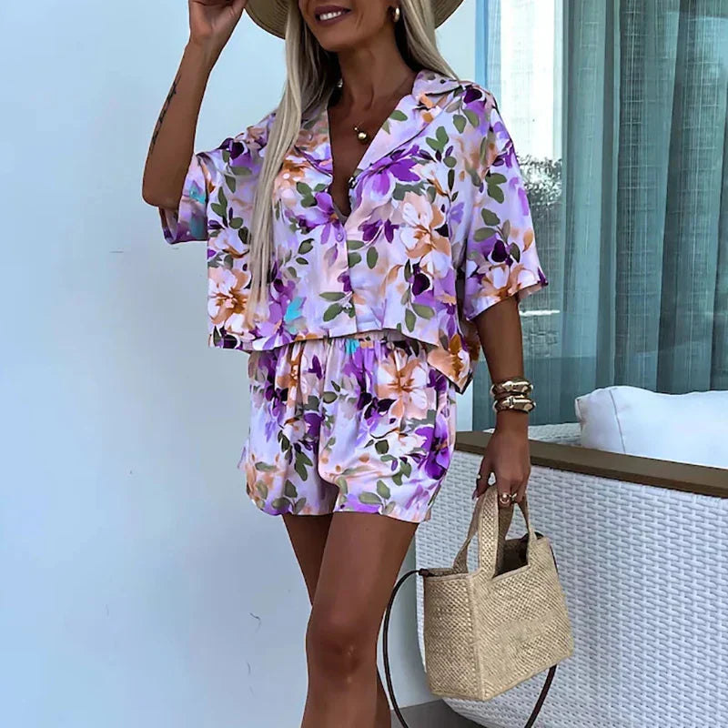 Yasmine - bloemen playsuit met riem