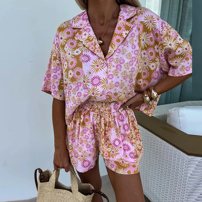 Yasmine - bloemen playsuit met riem